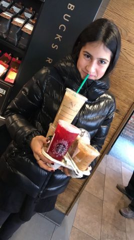 Yael Webber '20 stocks up on coffee for the day.