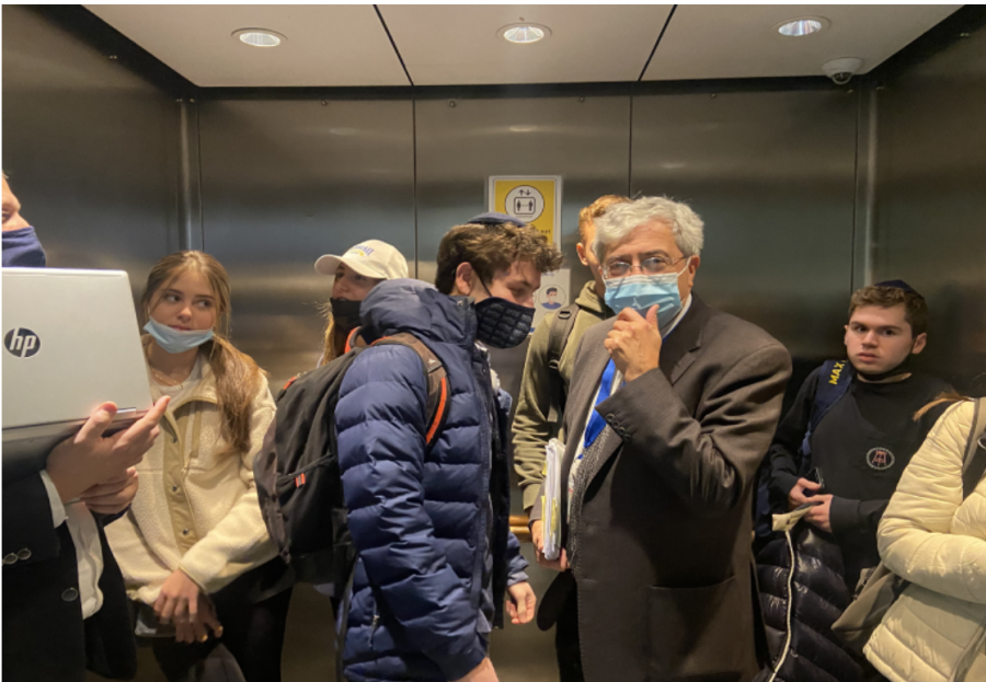 Rabbi Weiser pondering starting a minyan in the elevator.