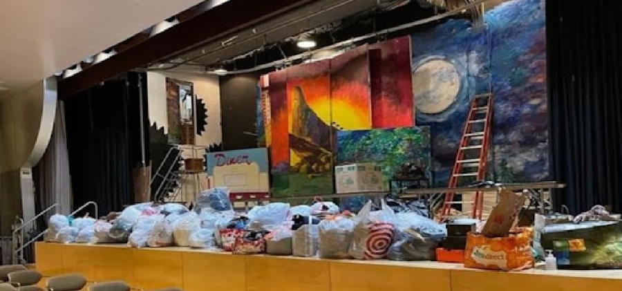 Donations for Bronx fire victims donated by the Ramaz community, displayed in the Upper School auditorium.